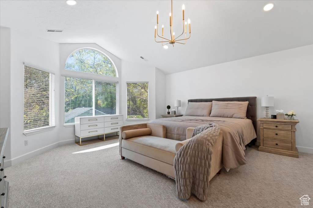 Carpeted bedroom with vaulted ceiling, multiple windows, a chandelier, baseboards, and recessed lighting