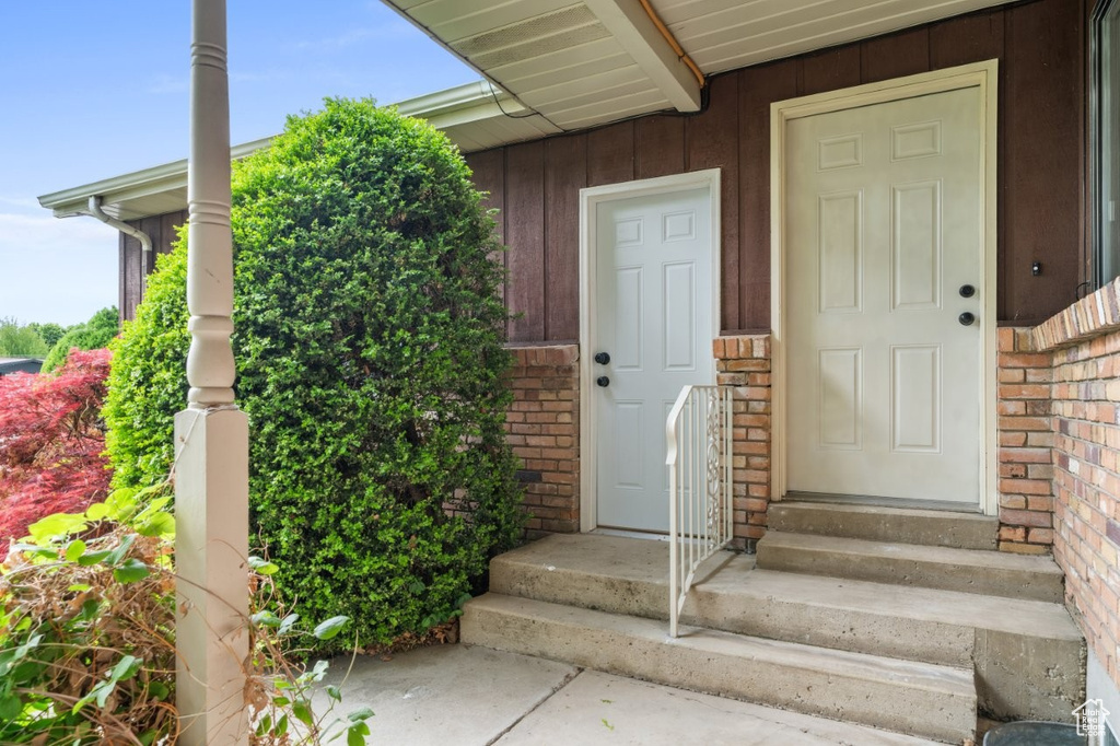 Property entrance with brick siding