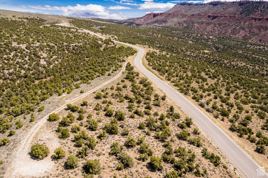 Overview of rural landscape with a mountain backdrop and a desert landscape
