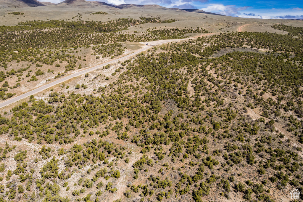 Aerial view of a mountainous background and a desert landscape