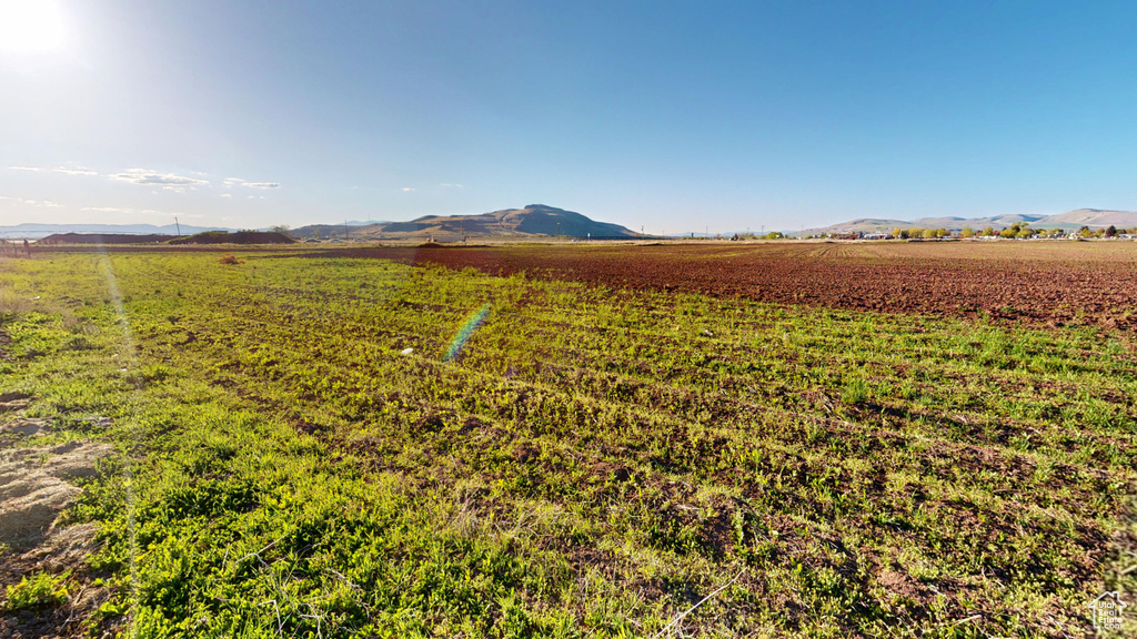 View of mountain backdrop featuring rural landscape