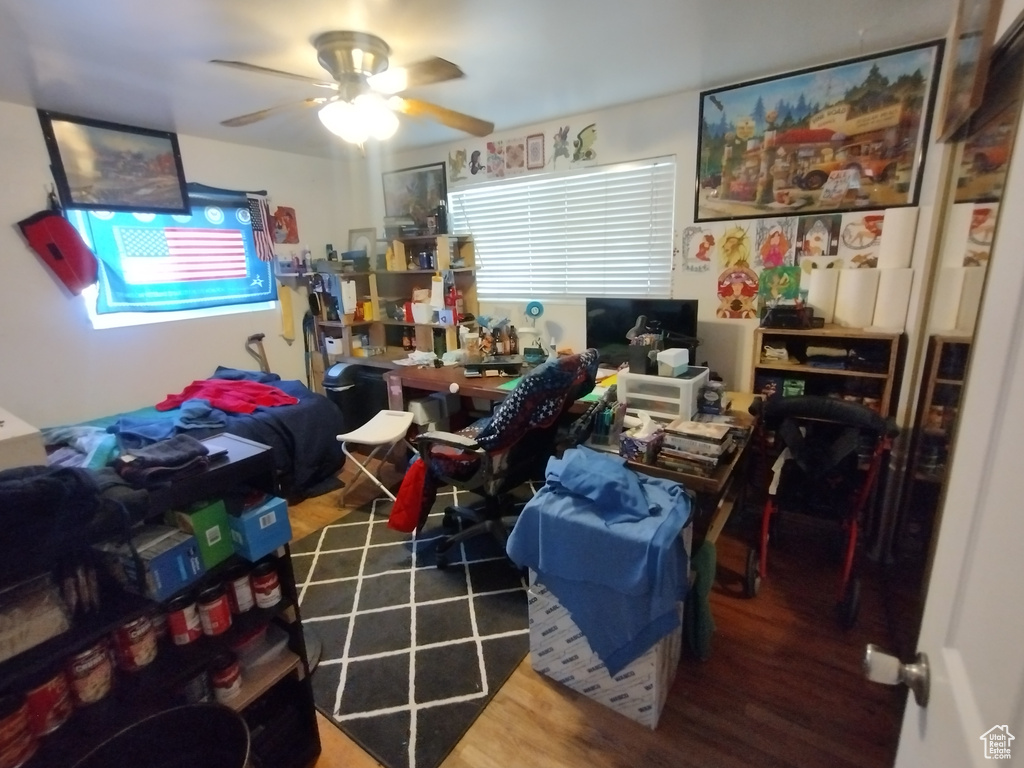 Office space featuring ceiling fan and wood finished floors