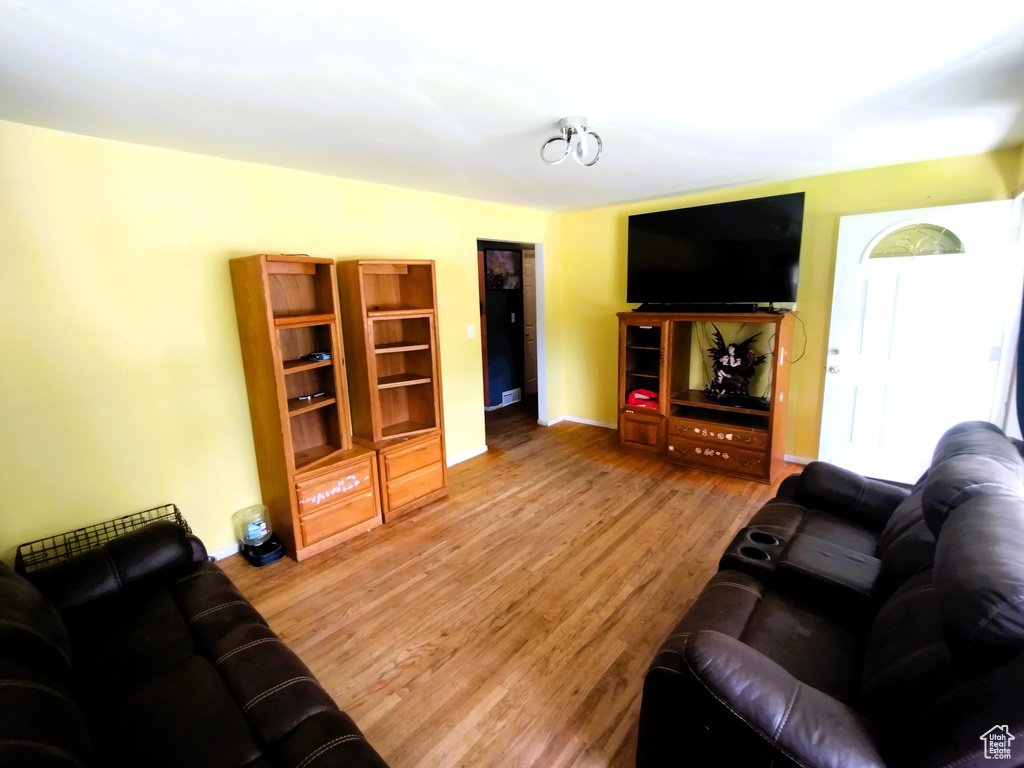 Living area featuring wood finished floors and baseboards