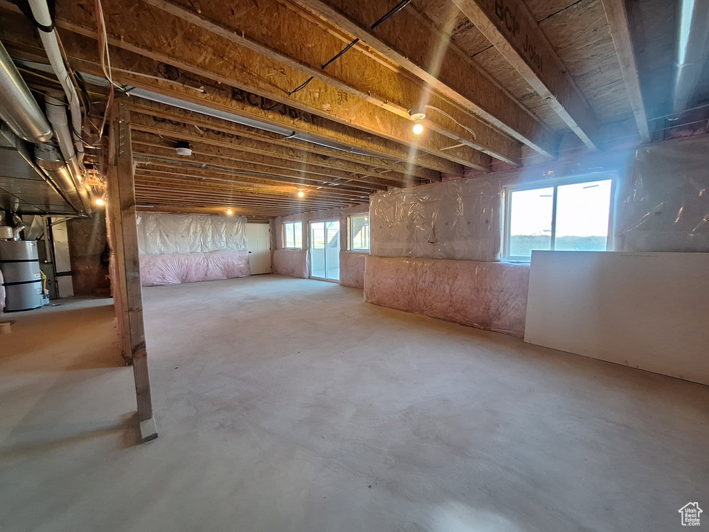 Basement with strapped water heater