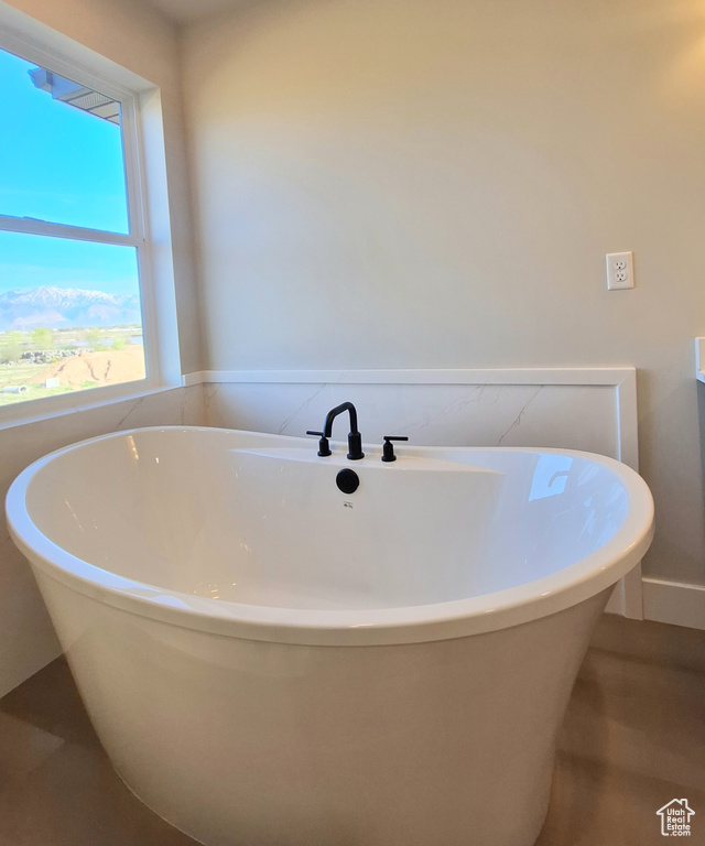 Full bathroom with a soaking tub