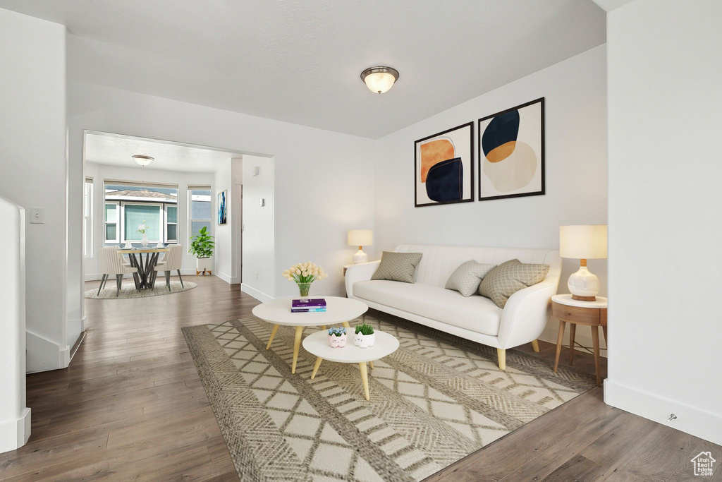Living room with wood finished floors and baseboards
