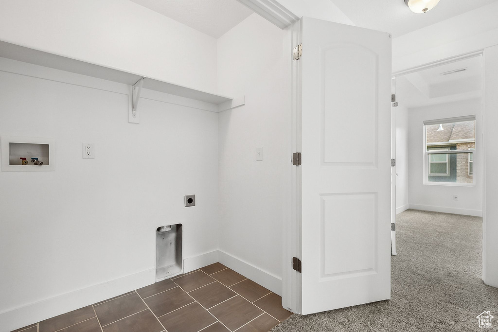 Laundry area with washer hookup, electric dryer hookup, and baseboards