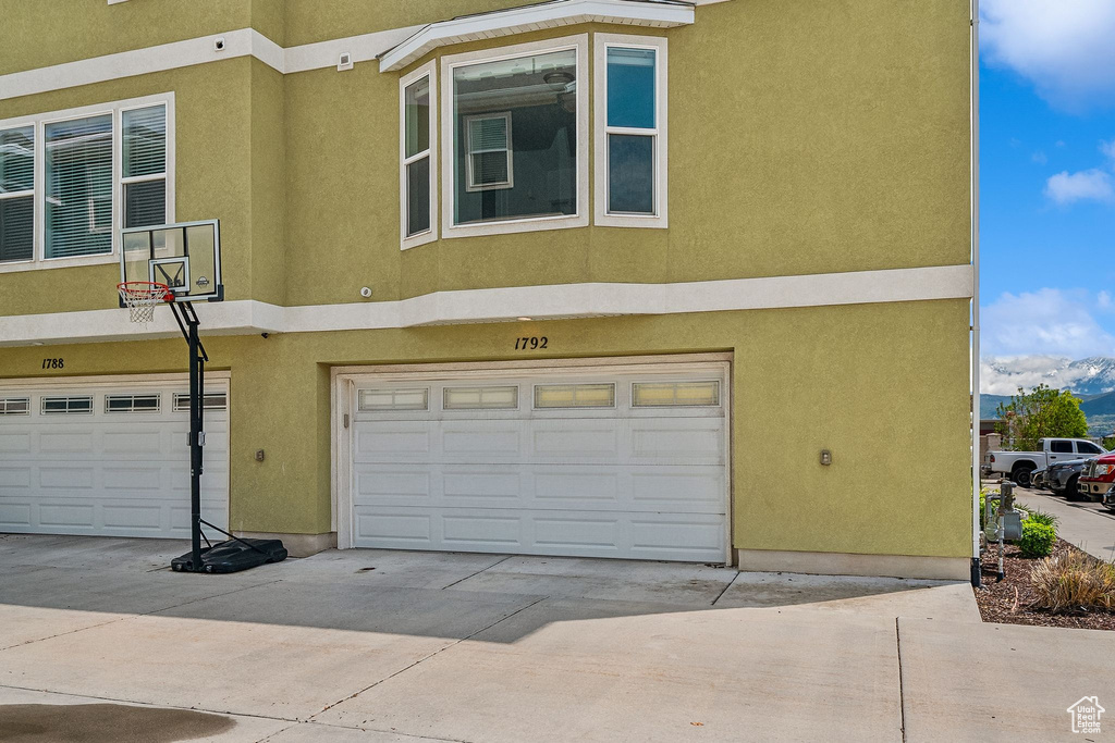 Garage with concrete driveway