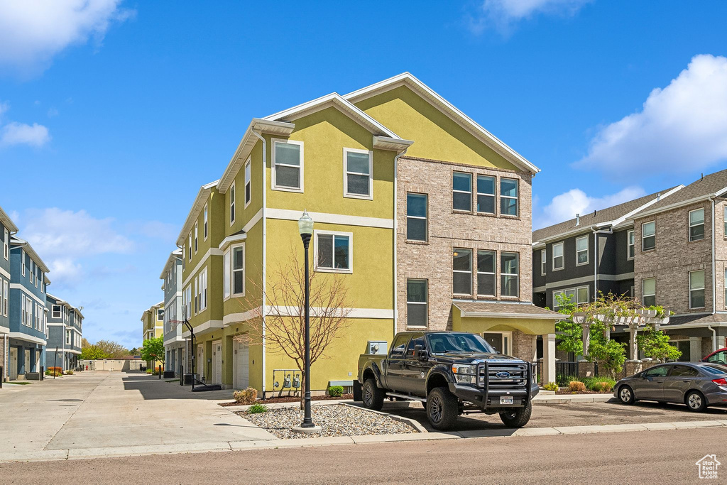 View of property with a residential view