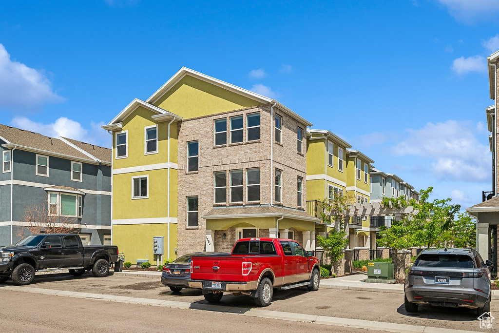 View of building exterior with a residential view