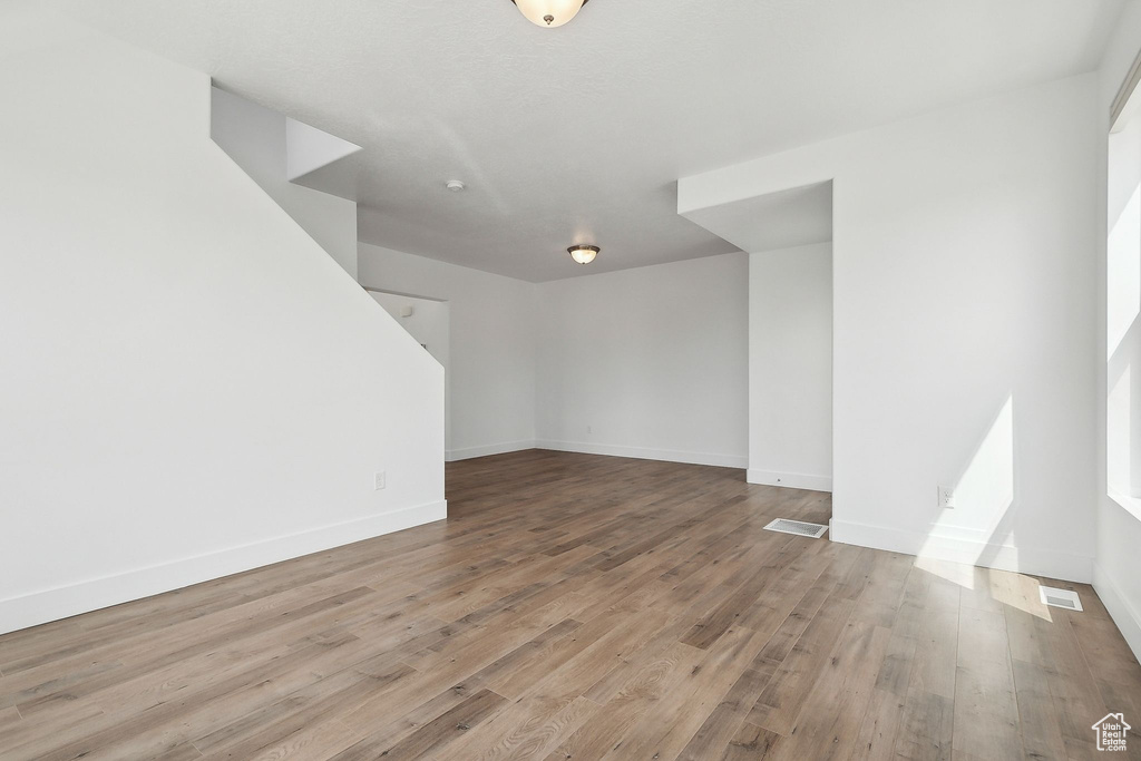 Spare room with wood finished floors and baseboards
