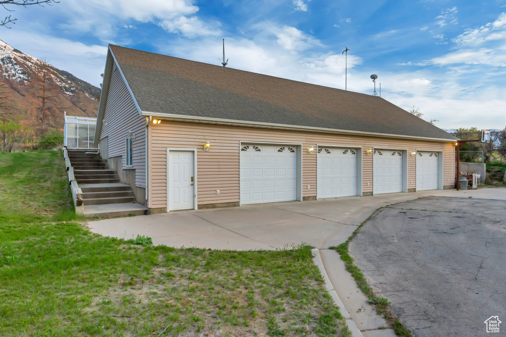 Detached garage with a mountain view