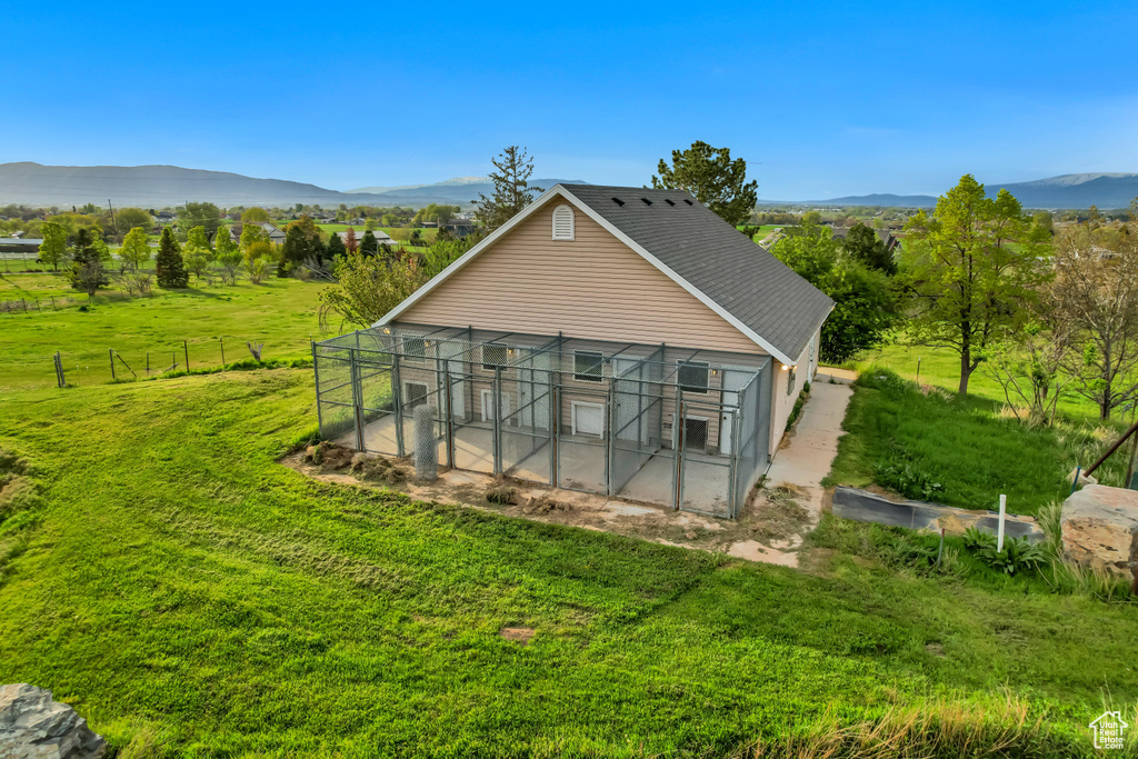 View of outbuilding featuring a mountain view and an outdoor structure