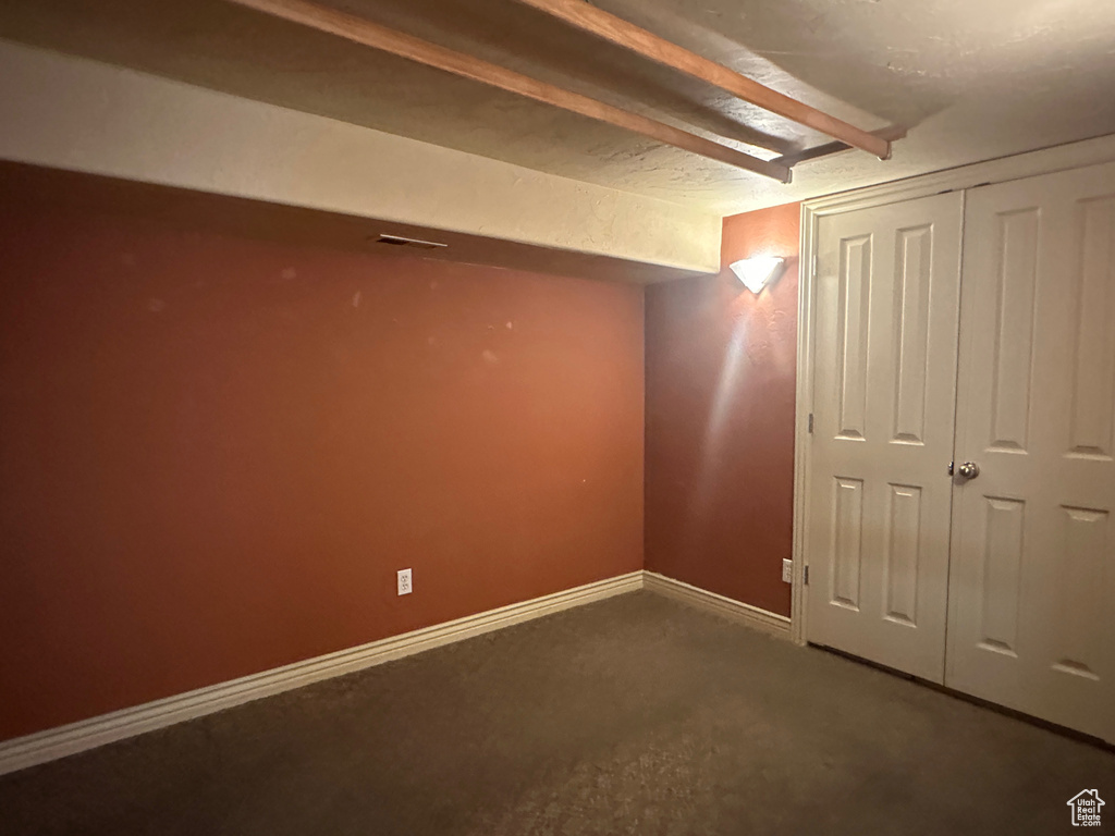 Finished basement featuring carpet flooring and baseboards
