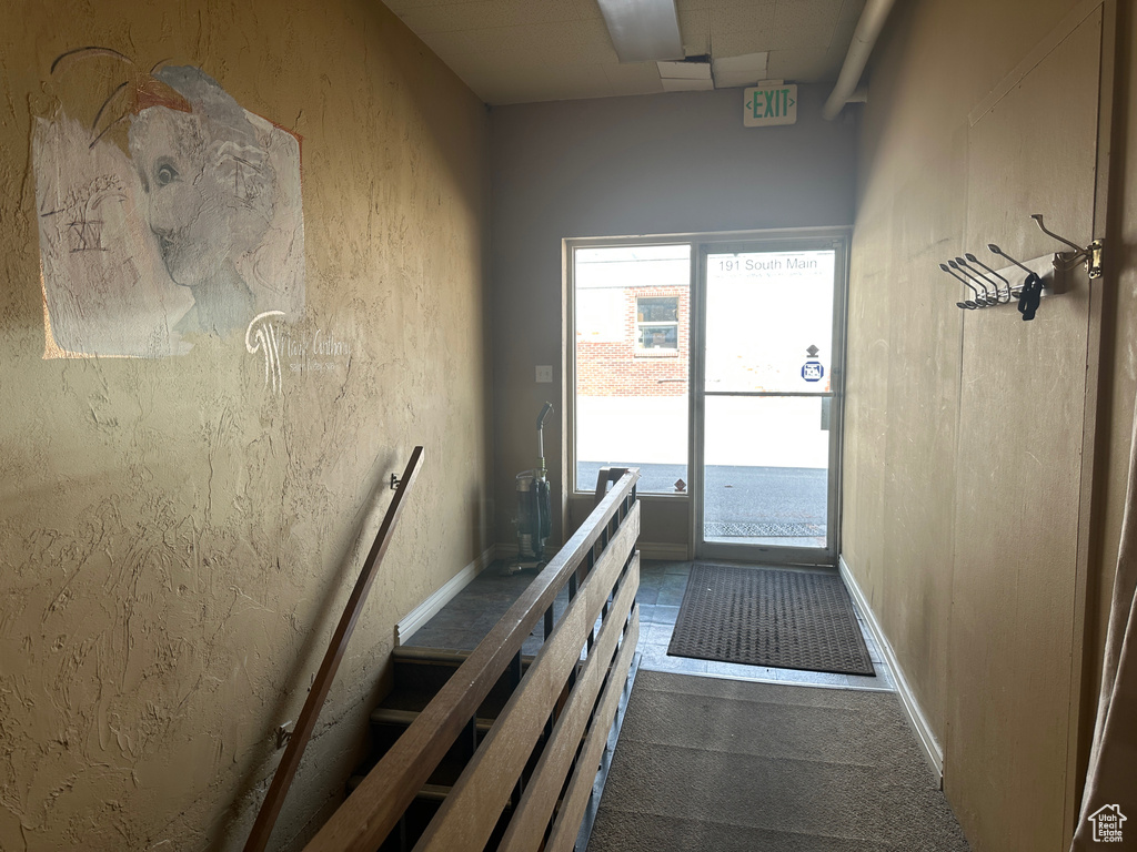Doorway with dark carpet