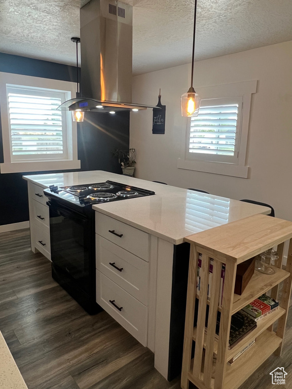 Kitchen with black range with electric stovetop, a textured ceiling, island exhaust hood, white cabinets, and dark wood-type flooring