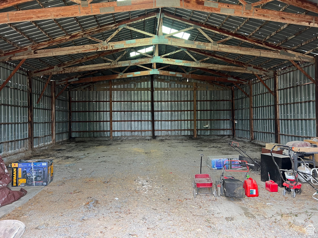 Misc room with lofted ceiling and metal wall