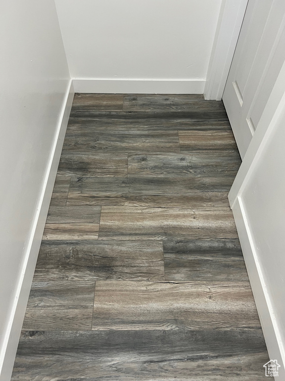 Detailed view of wood finished floors and baseboards