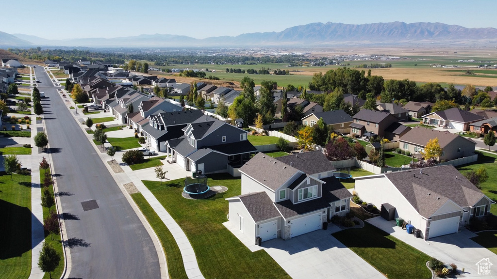 Aerial view of residential area featuring mountains