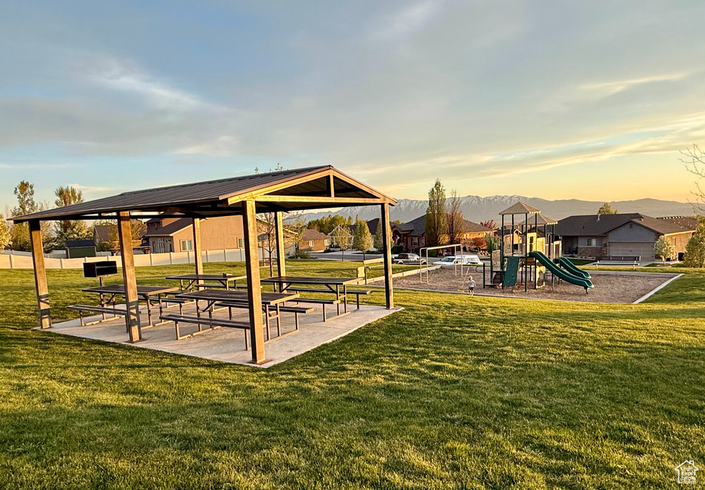 Community jungle gym with a gazebo and a lawn