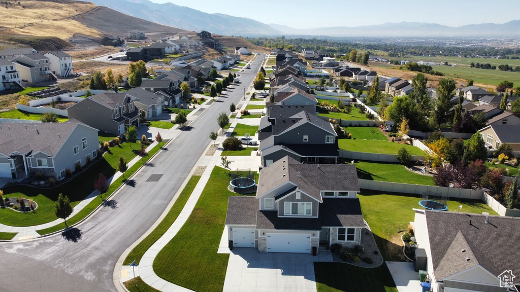 Aerial view of residential area with a mountainous background