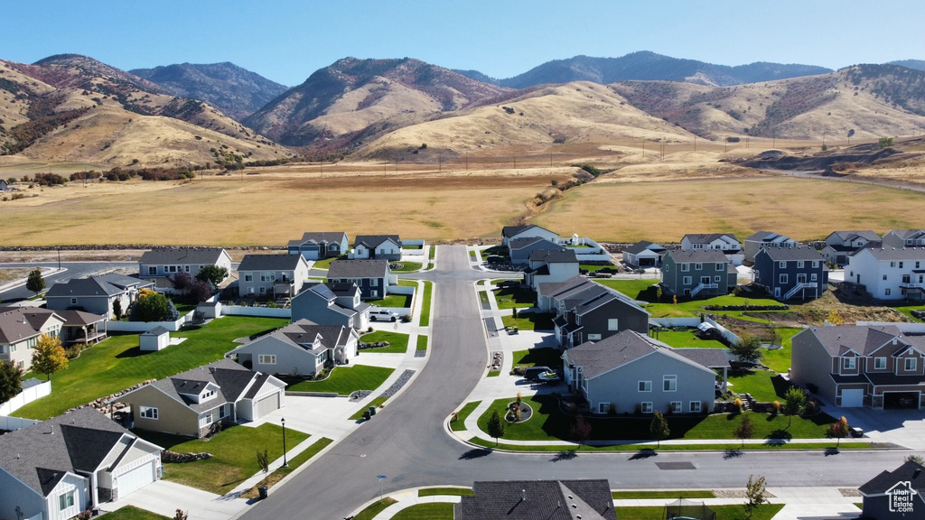 Aerial perspective of suburban area featuring a mountain backdrop