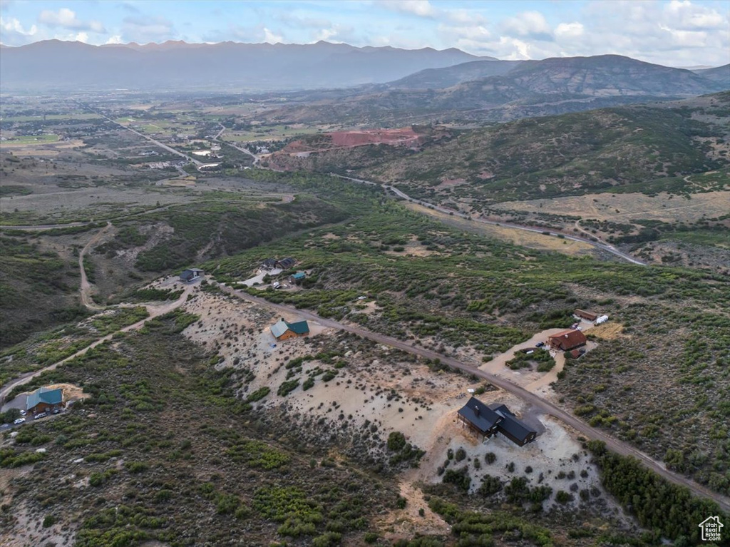 Aerial view of property's location with mountains and rural landscape