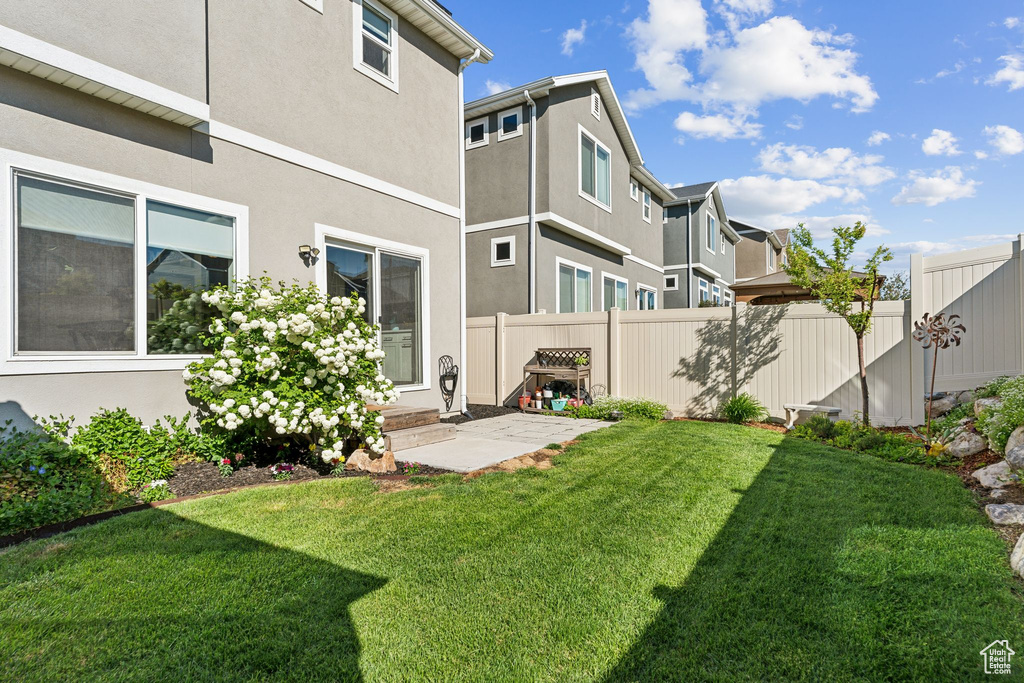 Rear view of property with stucco siding and a residential view