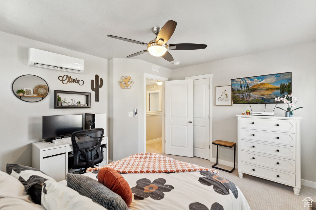 Bedroom featuring an AC wall unit, light carpet, baseboards, and a ceiling fan