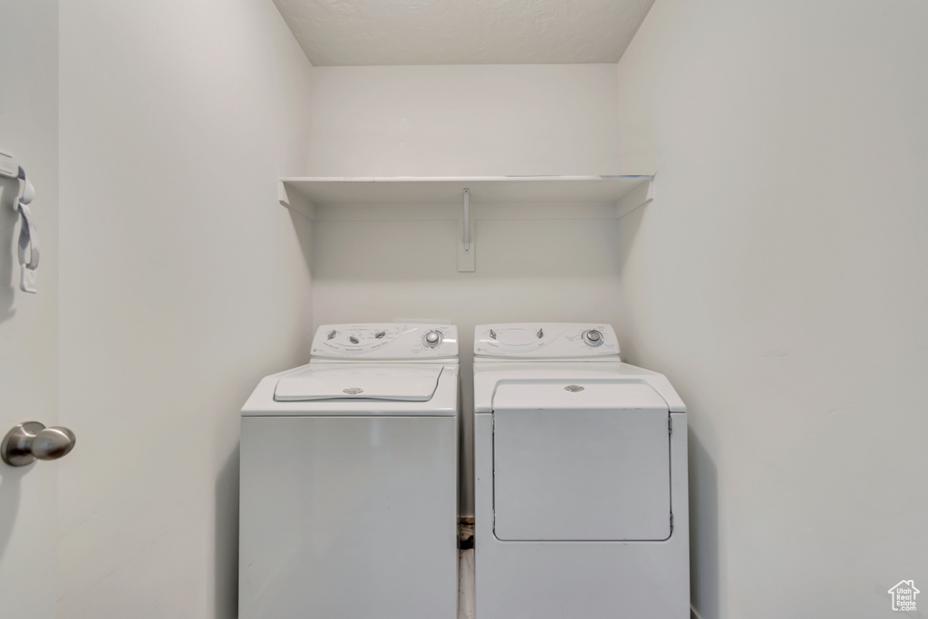 Washroom featuring washer and dryer