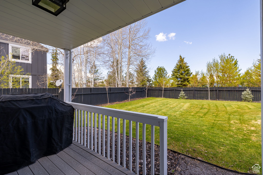 Deck featuring a grill