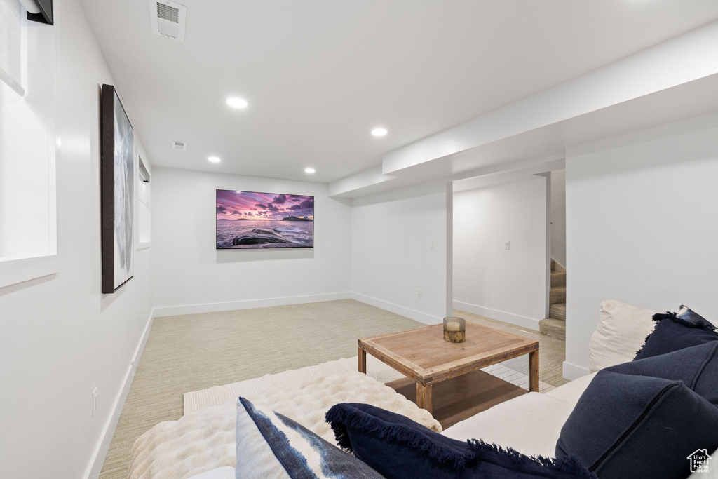 Living room featuring recessed lighting, stairway, light colored carpet, and baseboards