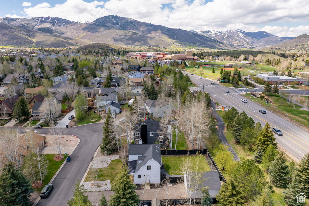 Aerial view of property\\\'s location featuring a mountain backdrop and nearby suburban area