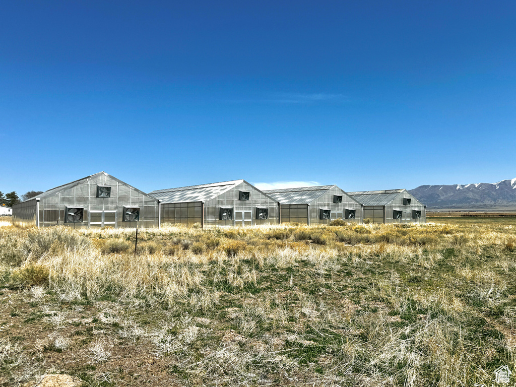 View of yard featuring an exterior structure and an outdoor structure