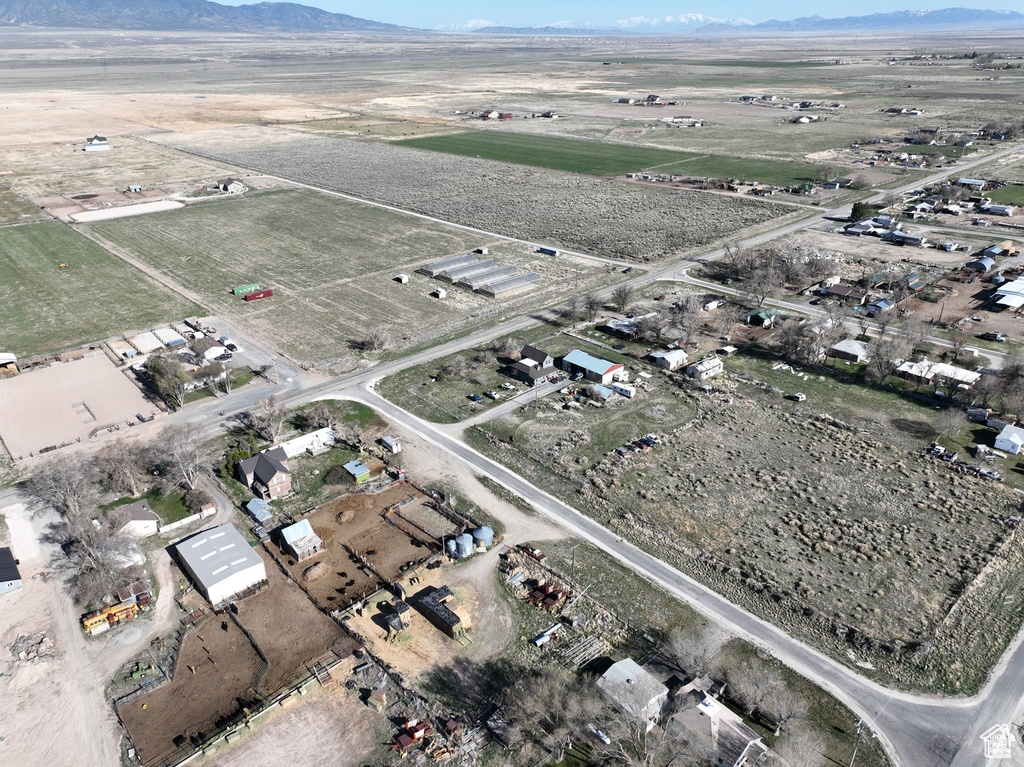 View of property location featuring a mountain backdrop and rural landscape
