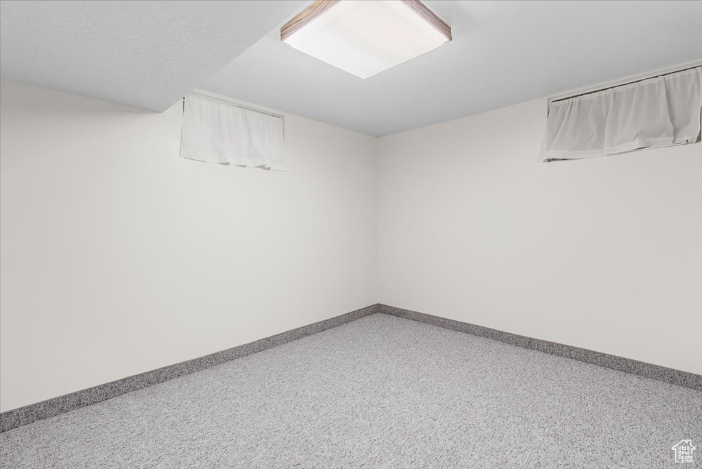 Spare room featuring baseboards
