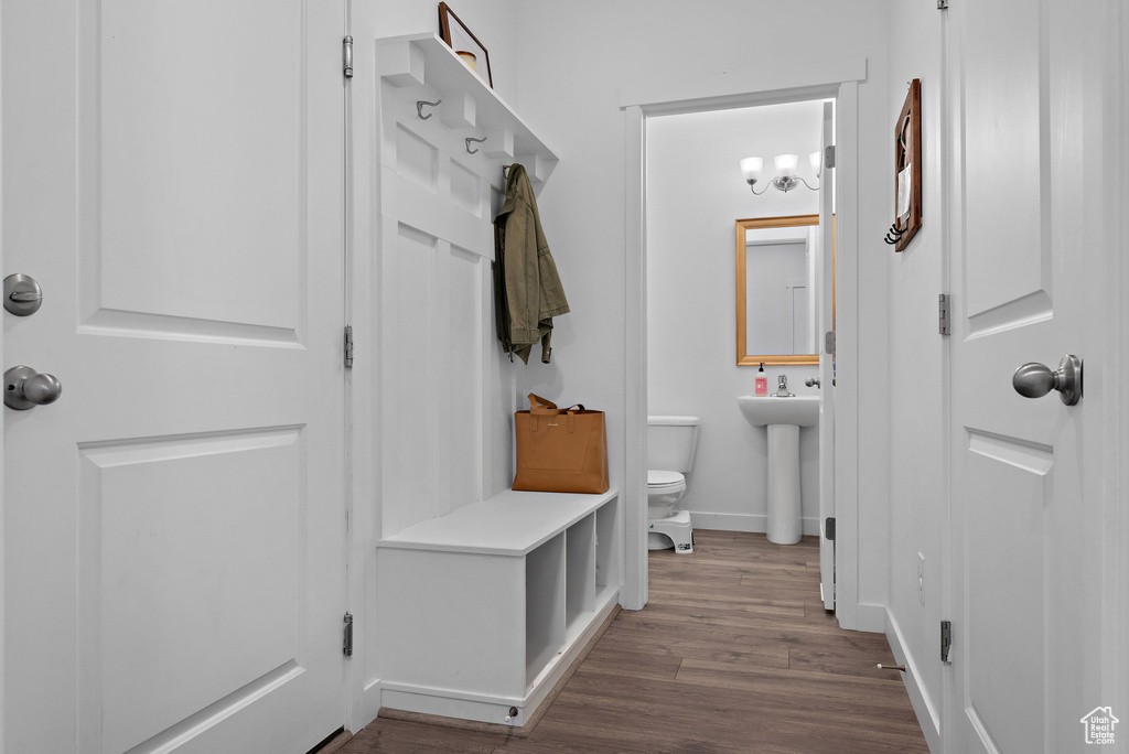 Mudroom featuring wood finished floors and baseboards