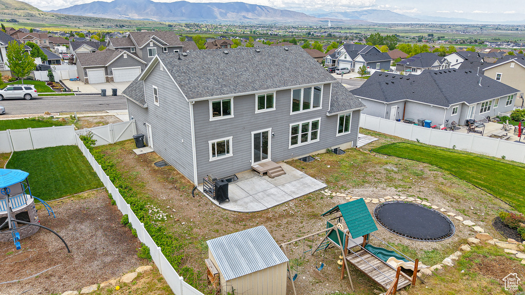 Aerial view of residential area featuring mountains