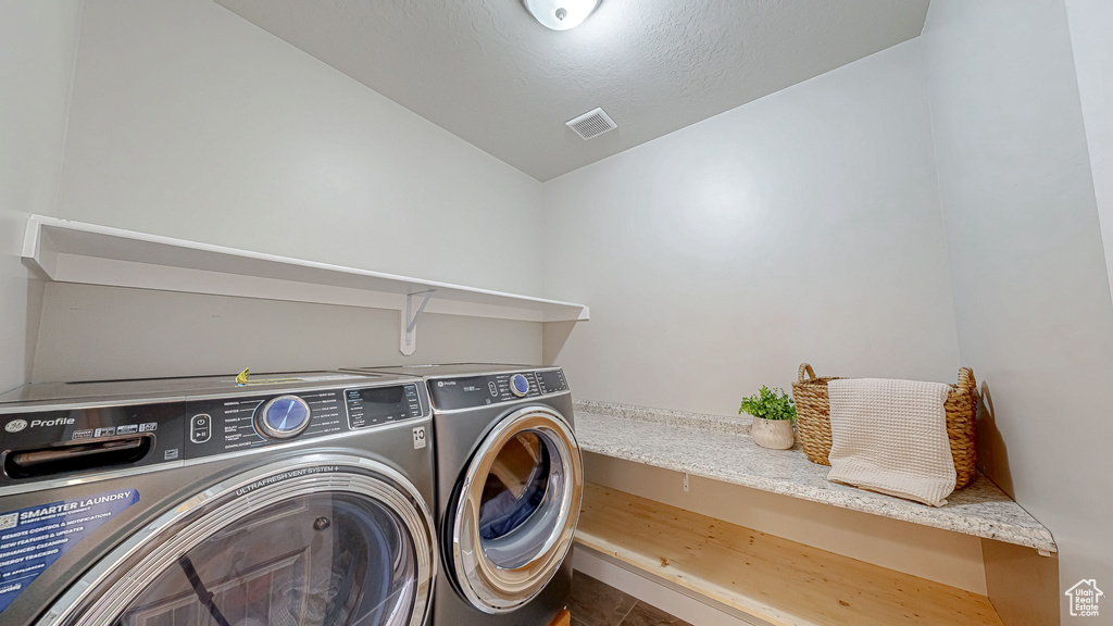 Laundry room featuring washing machine and clothes dryer