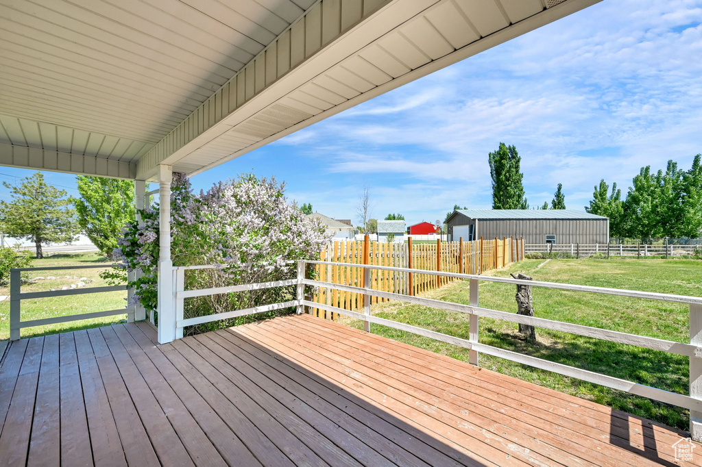 Wooden deck featuring an outdoor structure