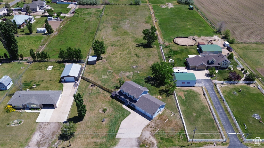 Aerial overview of property\'s location with rural landscape and nearby suburban area