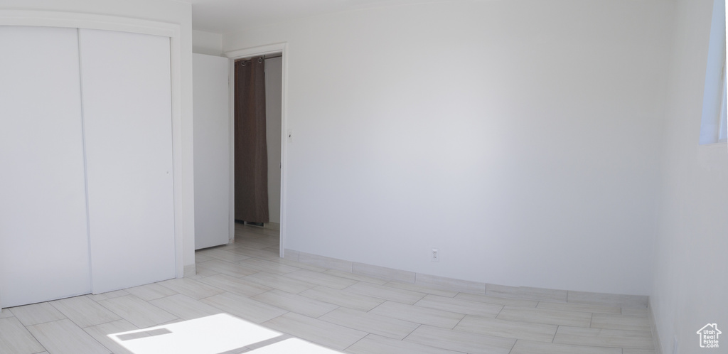 Unfurnished bedroom with a closet