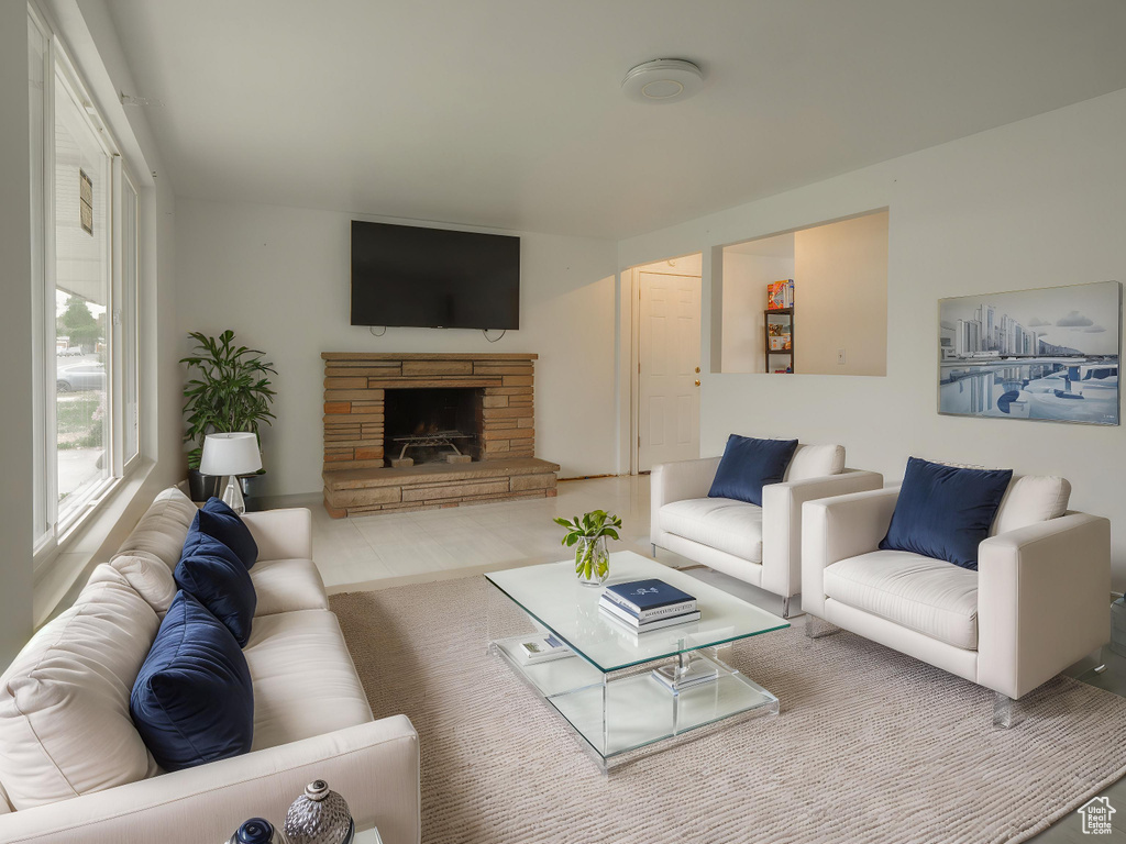 Living area with a stone fireplace