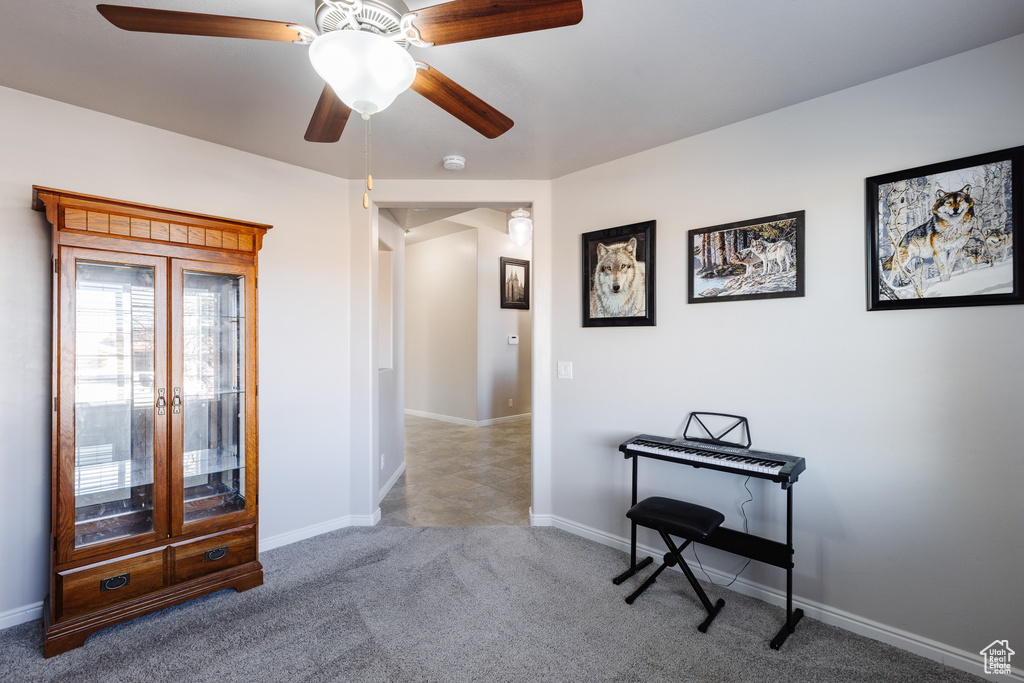 Interior space with ceiling fan and baseboards