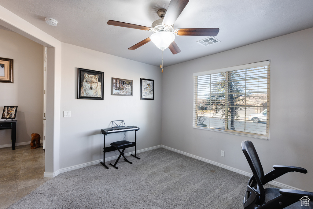 Office featuring visible vents, ceiling fan, carpet flooring, and baseboards