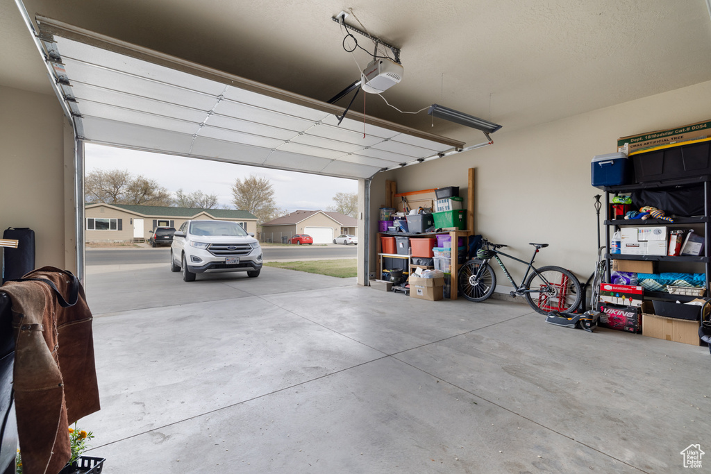 Garage featuring a garage door opener