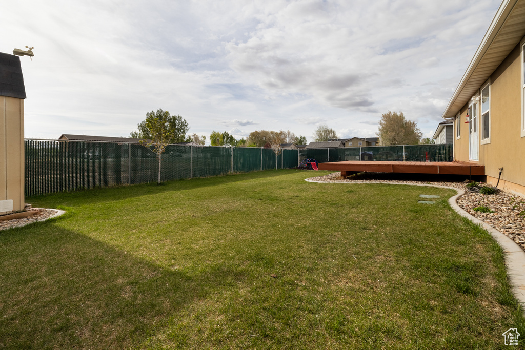 View of yard with a deck