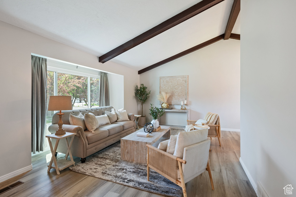 Living room featuring light wood finished floors and baseboards