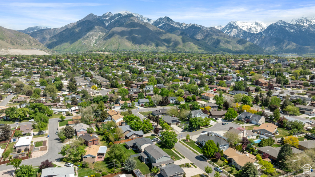 Aerial view of property\'s location with mountains and nearby suburban area