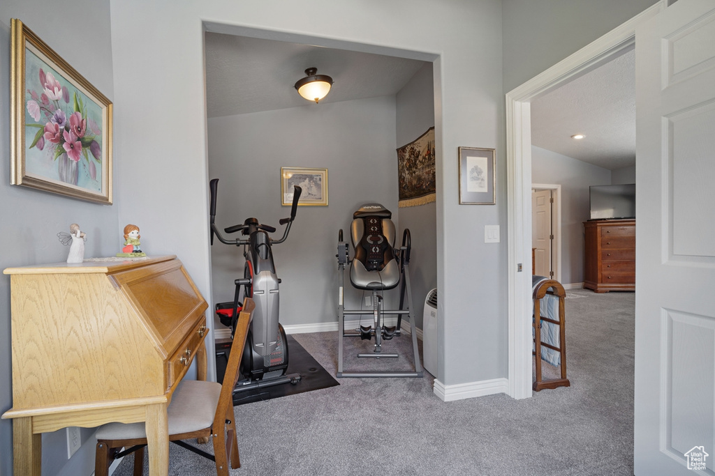 Workout area with carpet flooring and baseboards